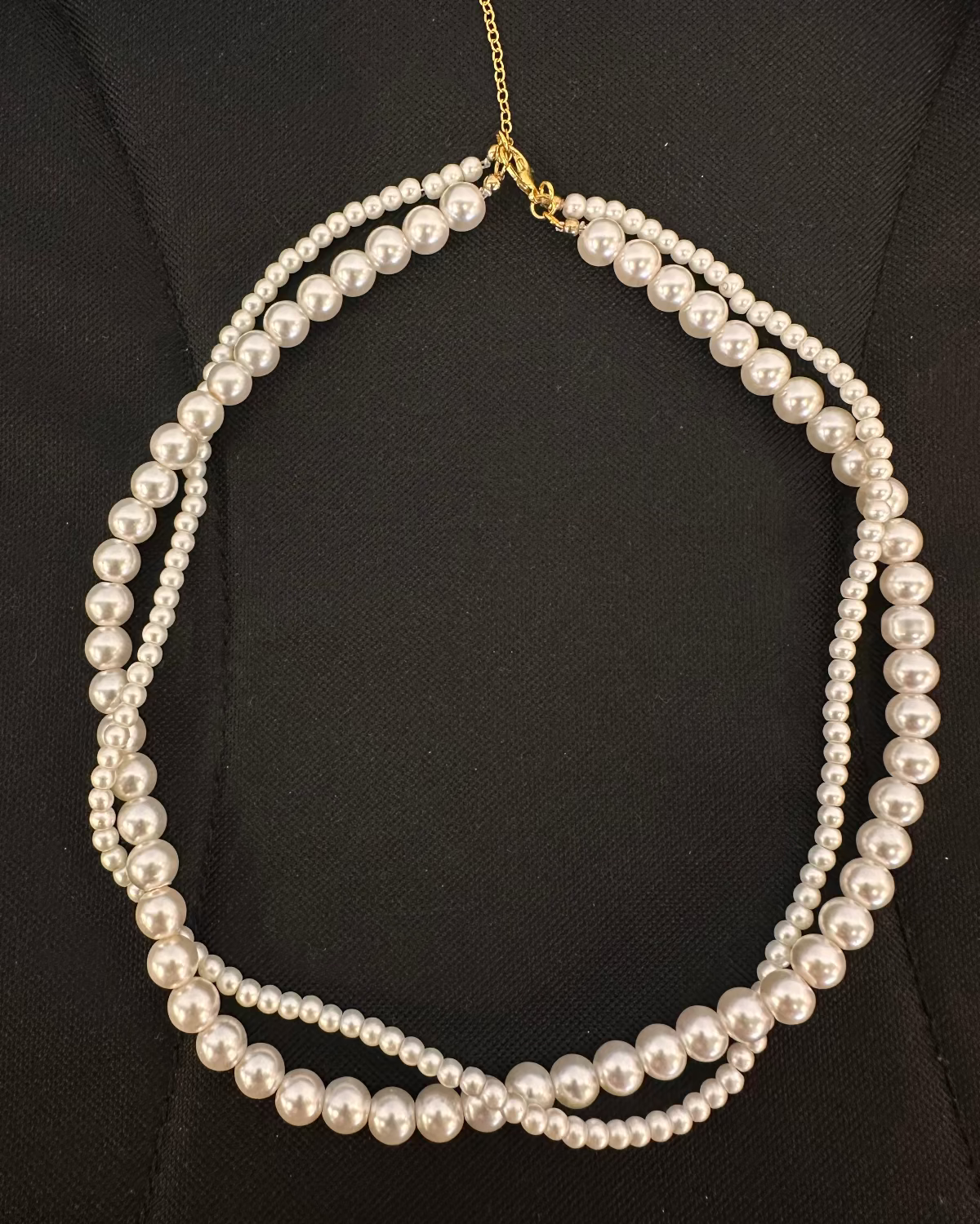 Pearl necklace on a black background